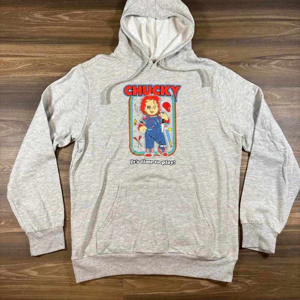 Gray Chucky hoodie with graphic of Chucky in overalls with the words 'It's time